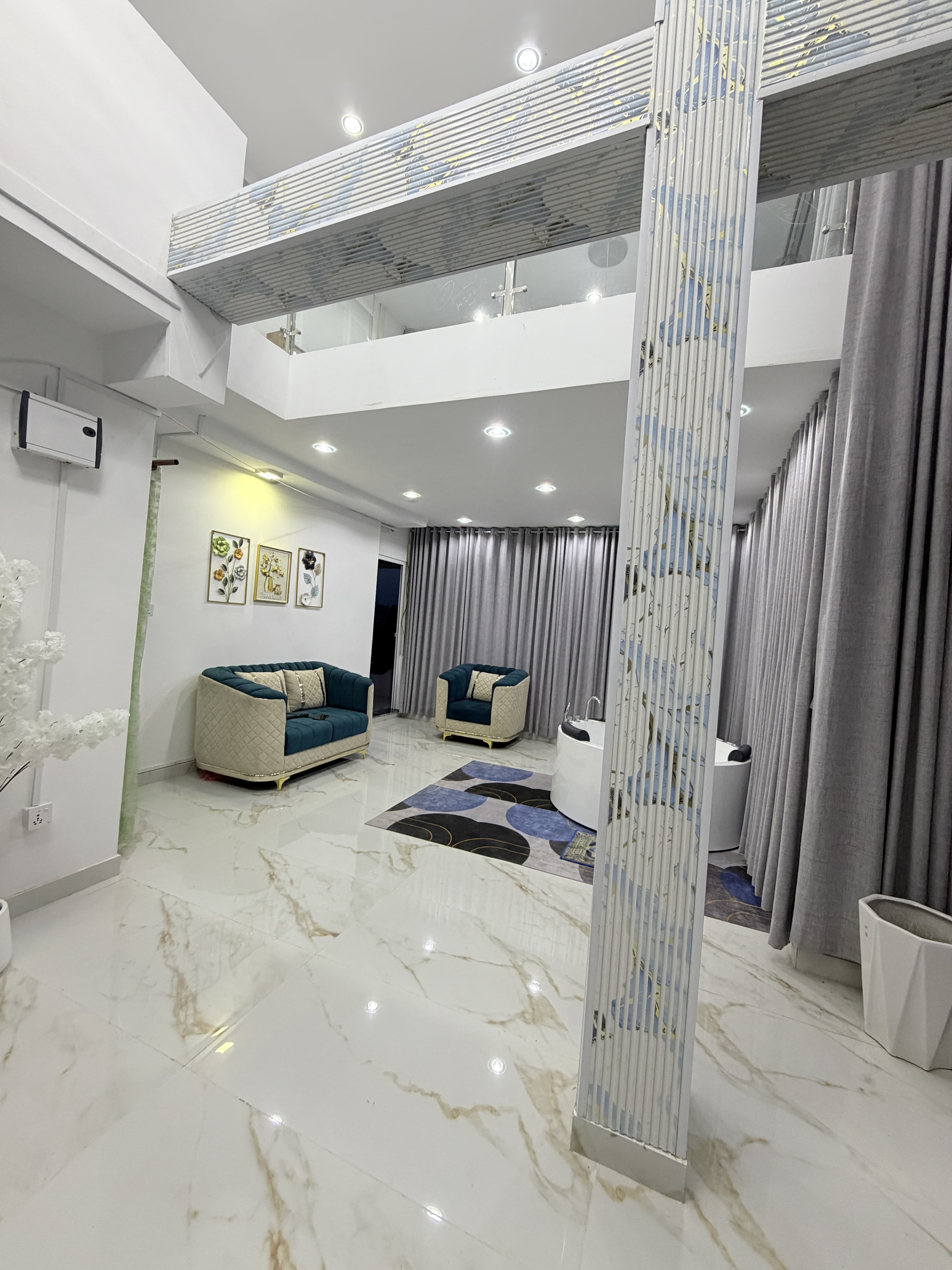 Polished marble hallway and architectural staircase