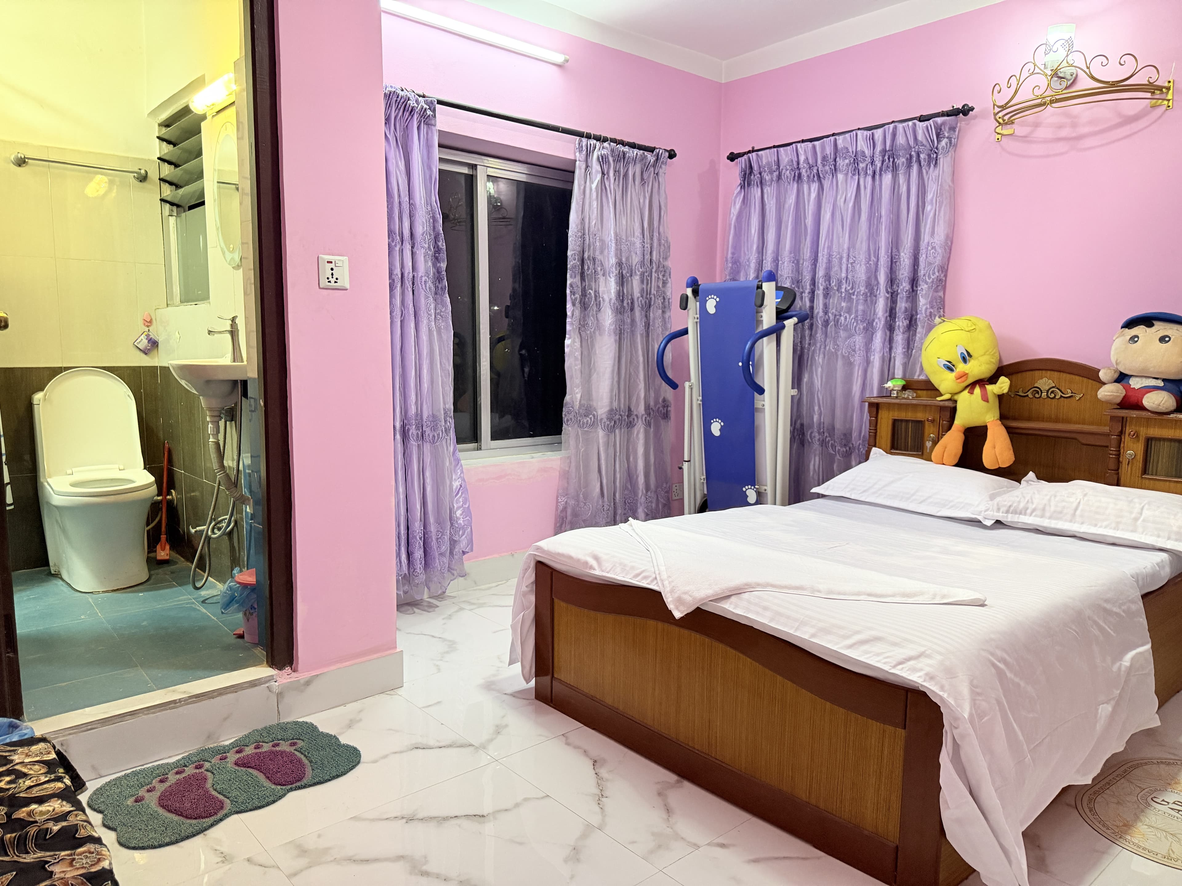 Plush bedding and crisp pillows in private guest room