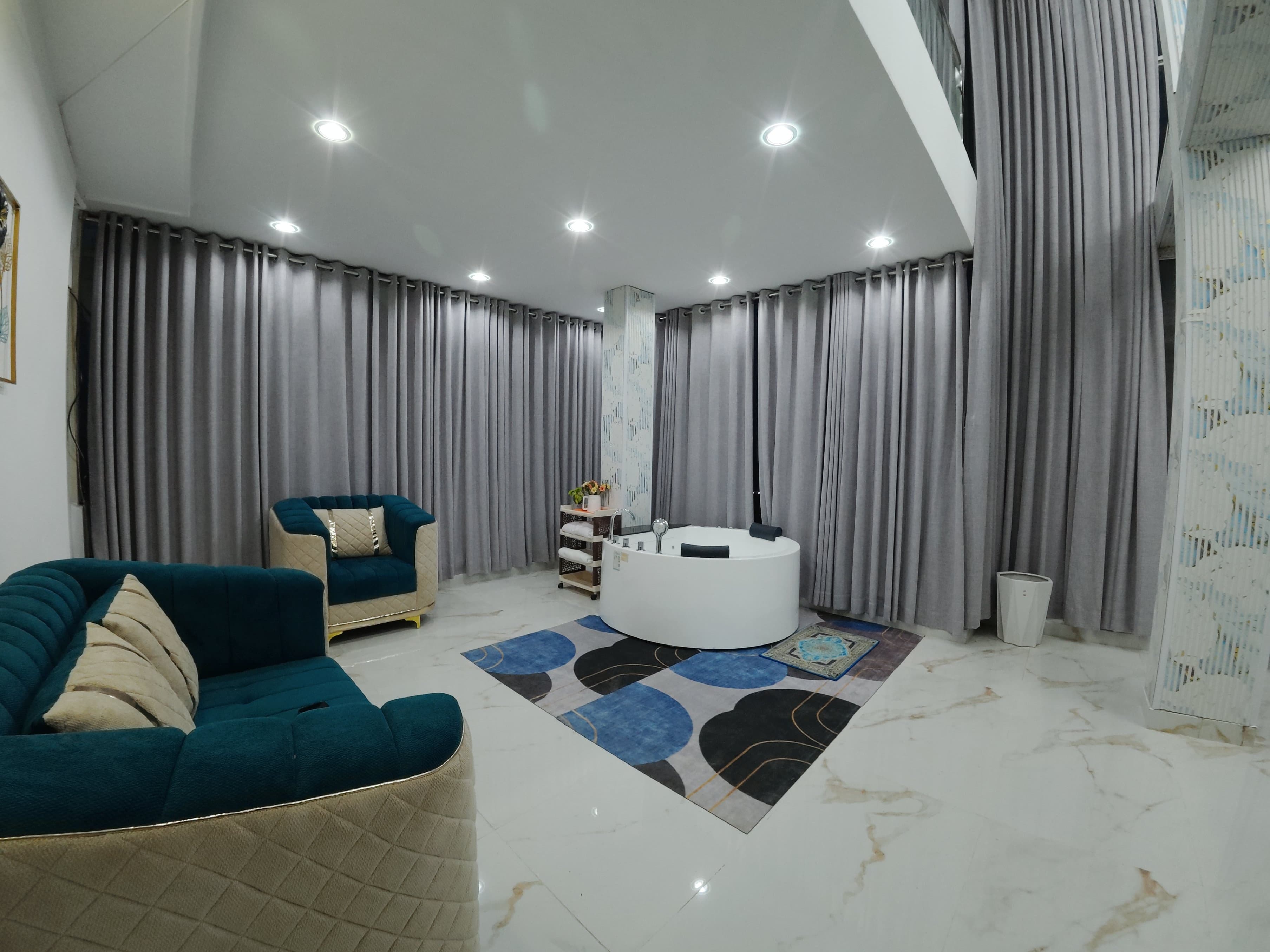 Private jacuzzi relaxation area with jet controls and ambient lighting
